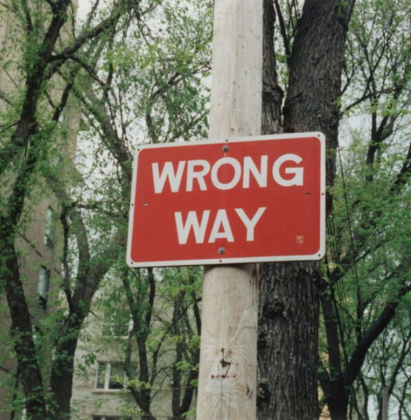 A road sign indicating the wrong path